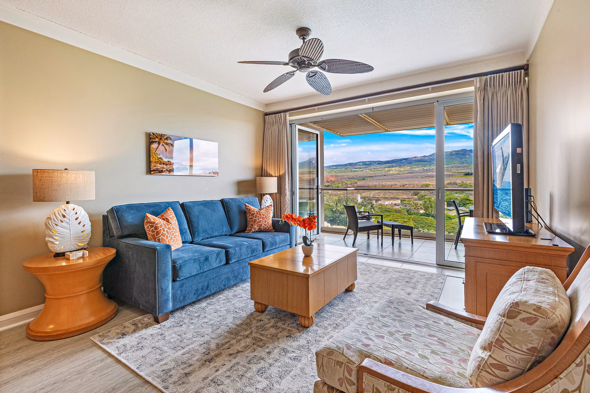 Mountain-view living room with lanai at Honua Kai penthouse